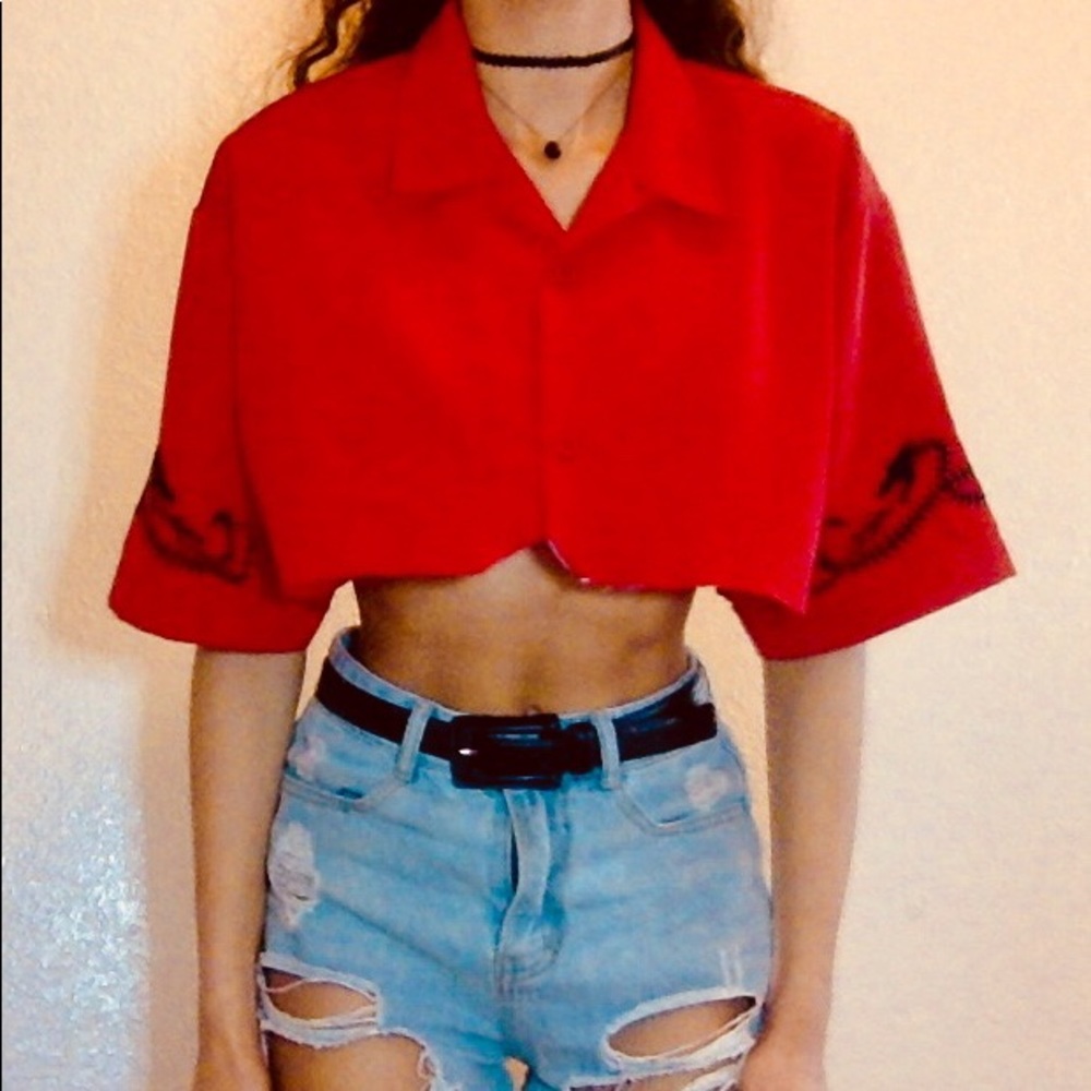 red cropped button up shirt with dragons on sleeve